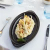Staub oval fiskform i gjutjärn, svart