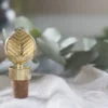 Stig L Berså flaskpropp, Guld